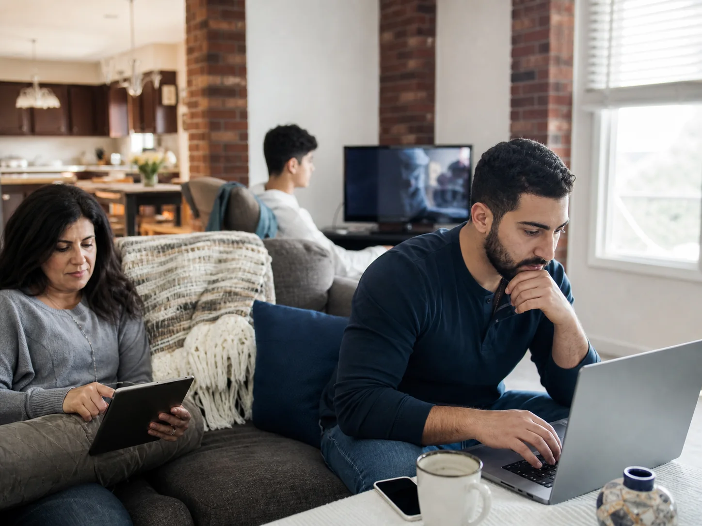 Dearborn household using a laptop, tablet and television on a shared home internet connection